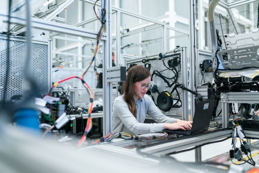 Engineer servicing industrial machinery
