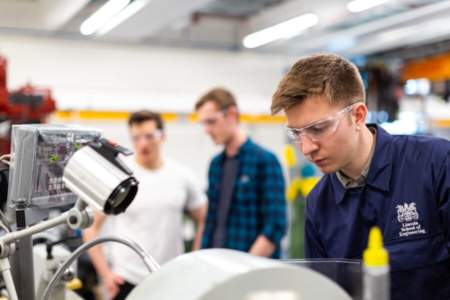 Engineer repairing industrial machinery